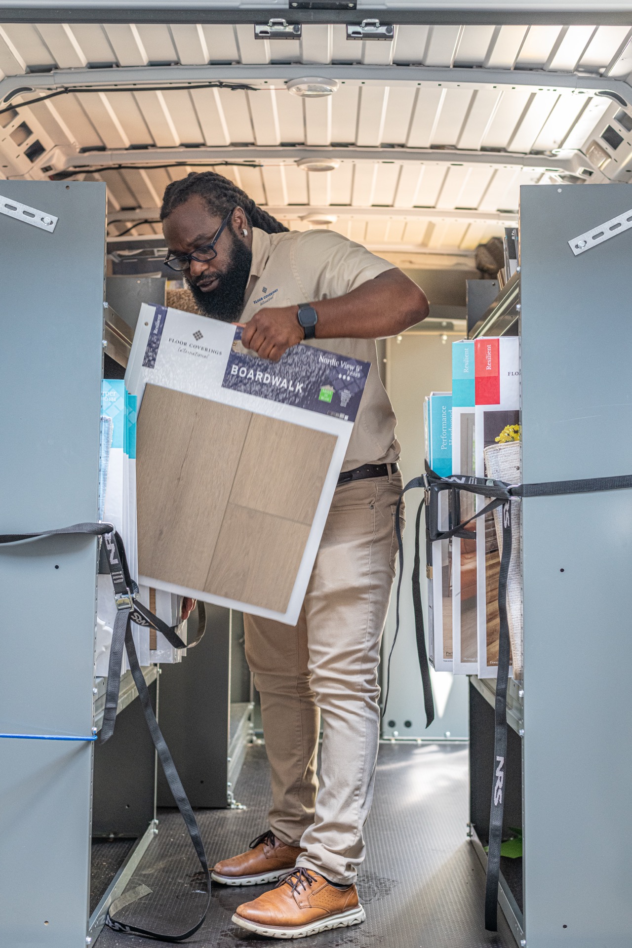 Design Associate showing flooring samples